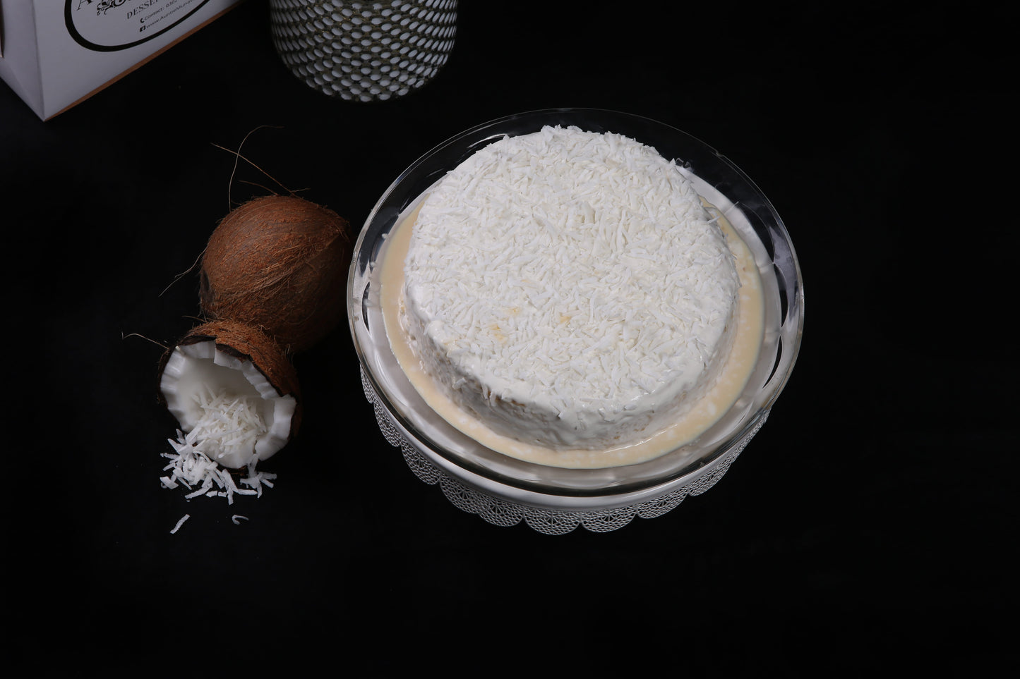 Coconut Infused Tres Leches Cake or Three Milk Cake with Coconut Cream Topping and Coconut Flakes