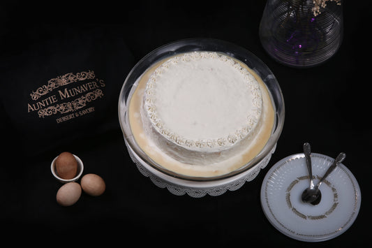 Cream Tres Leches Cake: Soft sponge soaked in a creamy Tres Leches blend, topped with a smooth layer of fresh cream.