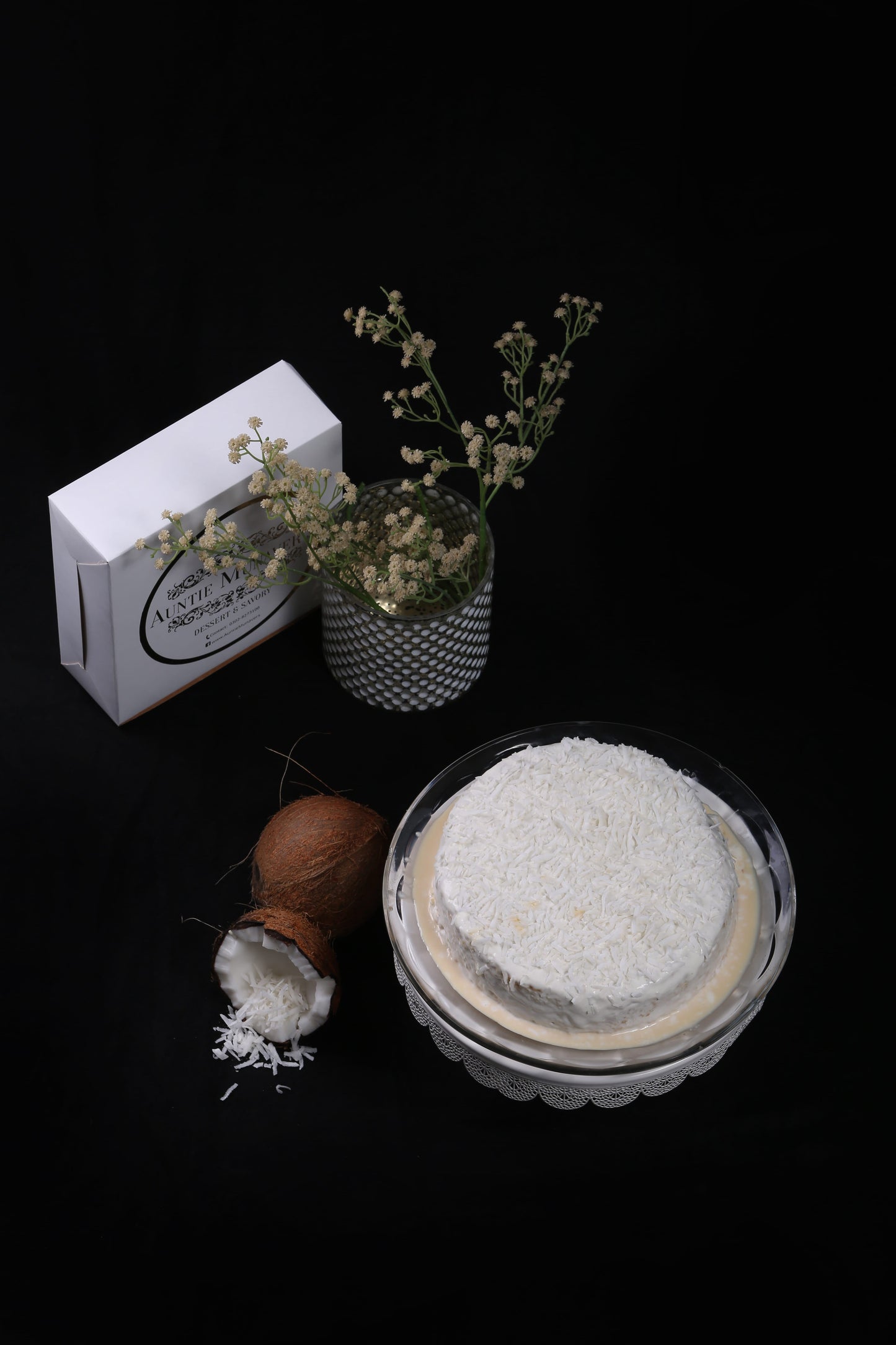Coconut Infused Tres Leches Cake or Three Milk Cake with Coconut Cream Topping and Coconut Flakes
