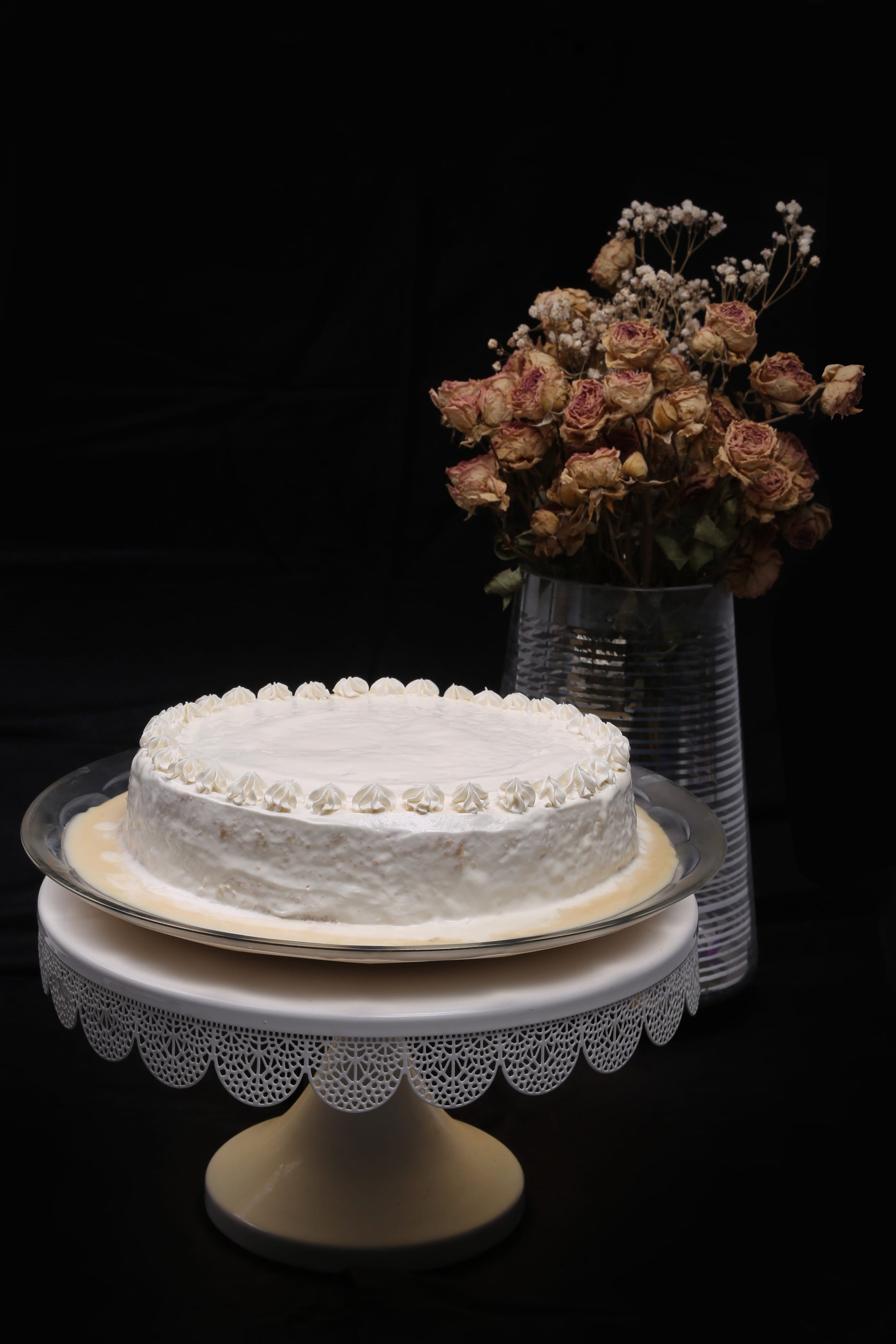 Cream Tres Leches Cake: Soft sponge soaked in a creamy Tres Leches blend, topped with a smooth layer of fresh cream.