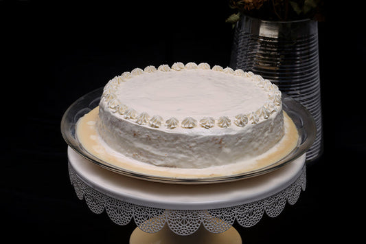 Cream Tres Leches Cake: Soft sponge soaked in a creamy Tres Leches blend, topped with a smooth layer of fresh cream.