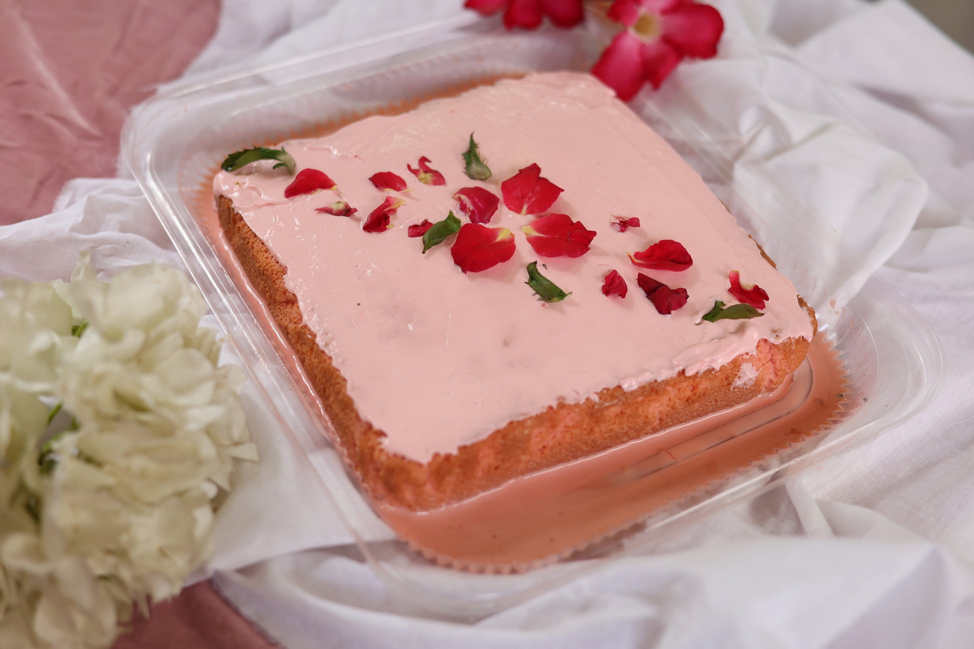 Rose Flavored Tres Leches Cake: Soft sponge soaked in a delicate rose-infused Tres Leches blend, topped with rose-infused cream and a hint of floral sweetness.