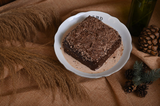 Triple Chocolate Tres Leches Cake: A rich chocolate sponge soaked in our signature Tres Leches blend, filled and covered with decadent chocolate, and topped with chocolate chunks for the ultimate chocolate indulgence.